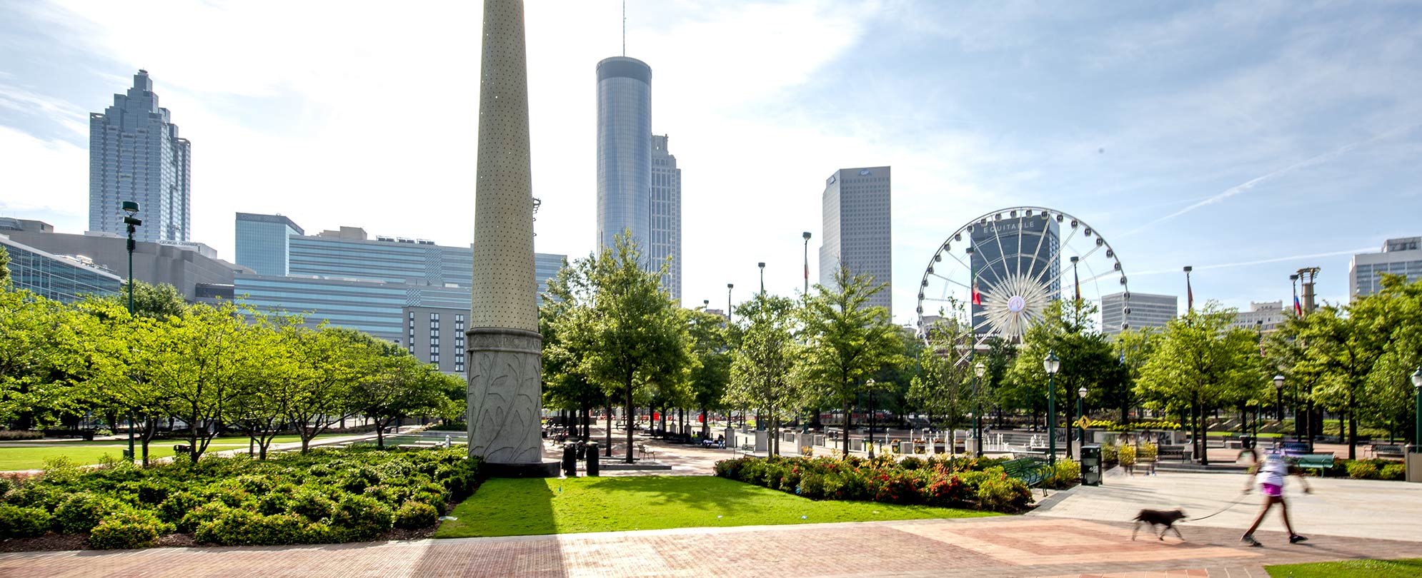 Daytime shot of downtown Atlanta’s Centennial Olympic Park with the SkyView Ferris wheel in the background.