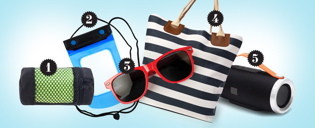 Five gift items on a light blue background: a green rolled up beach towel, blue waterproof phone pouch, red sunglasses, navy stripped bag, and black portable speaker.