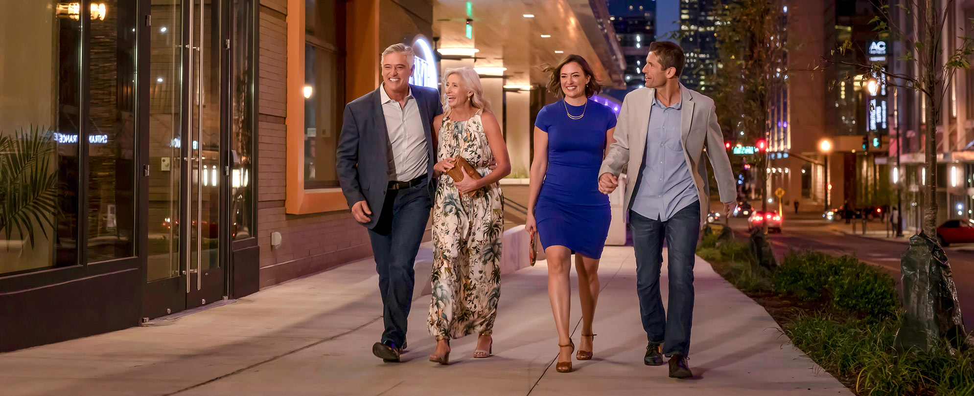 Two couples enjoying a night out on vacation. 