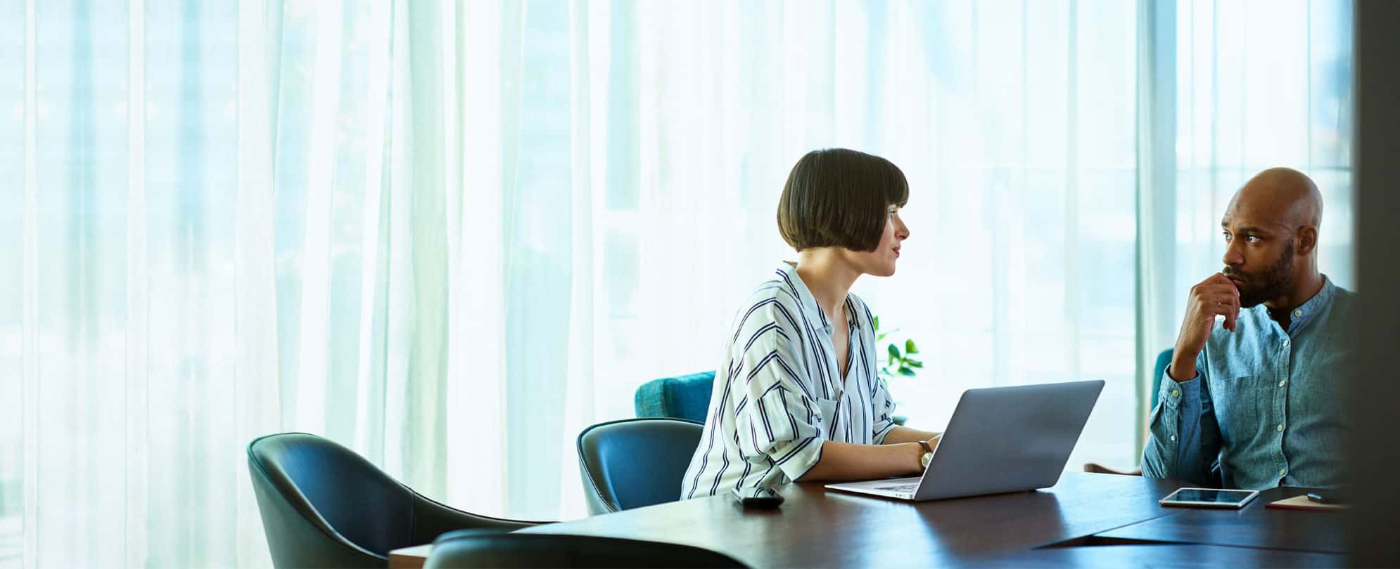 A man having a sit-down meeting in an office with a timeshare attorney. 