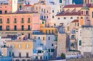 Italy's Amalfi Coast, with colorful buildings and roadway built into the waterfront mountainside.