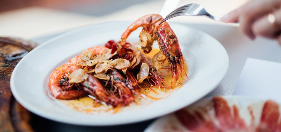 A piece of a seafood dish on a fork at one of the top restauraunts in St. Thomas, U.S. Virgin Islands.